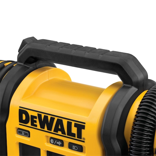 Close-up of the handle and controls of a DEWALT portable device, featuring a yellow and black design with a visible brand logo.