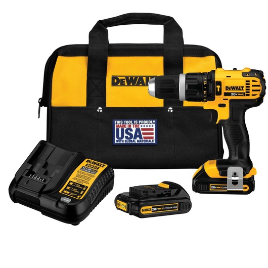 A DEWALT 20V Max cordless drill kit, including a yellow and black drill, two lithium-ion batteries, a charger, and a carrying bag with the DEWALT logo and a label indicating it is made in the USA with global materials.