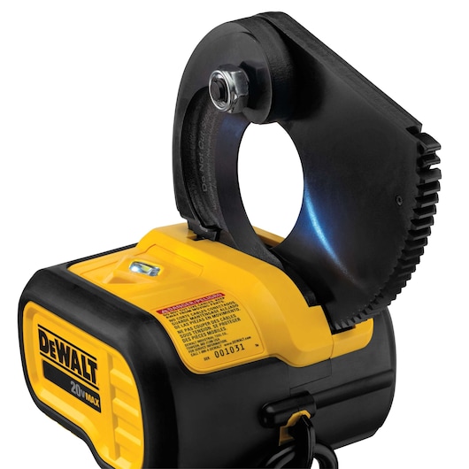 Close-up view of a DEWALT 20V MAX cordless tool, specifically a cable cutter, showing the yellow and black body with a warning label and the cutting jaws open.
