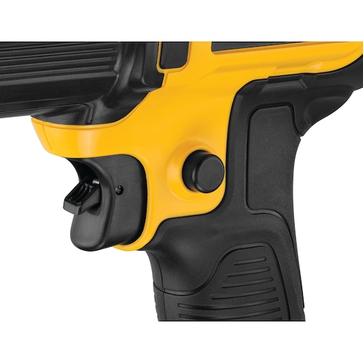 Close-up image of the handle and trigger area of a yellow and black DEWALT cordless tool, showing the trigger and control button.