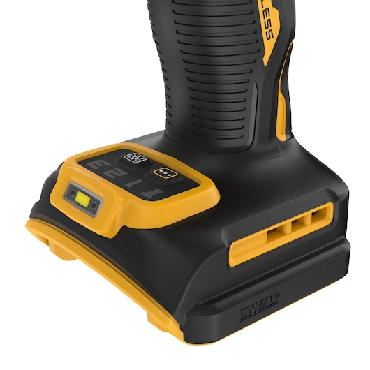 Close-up image of the lower section of a DEWALT cordless power tool, showing the handle with textured grip, a yellow and black control panel with buttons, indicator lights, and branding details.