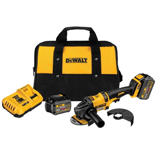 A DEWALT cordless grinder kit including a yellow and black tool bag, a cordless angle grinder, two batteries, a charger, and a grinder guard.