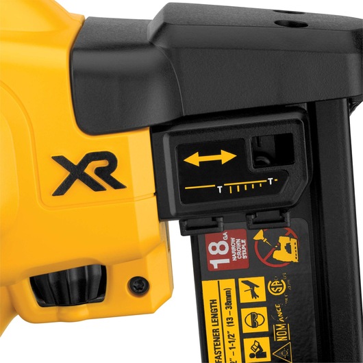 Close-up of a yellow and black DEWALT XR tool, showing a side view with adjustment markings and icons for fastener length, 18 gauge staples, and safety warnings.