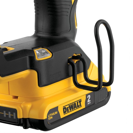 Close-up view of the lower section of a DEWALT cordless tool, showing the lithium ion battery pack rated at 2 amp hours and a metal belt hook attachment.
