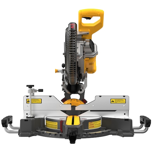 Front view of a DEWALT DCS781B miter saw with a yellow handle and silver base, featuring measurement guides and safety warning labels.
