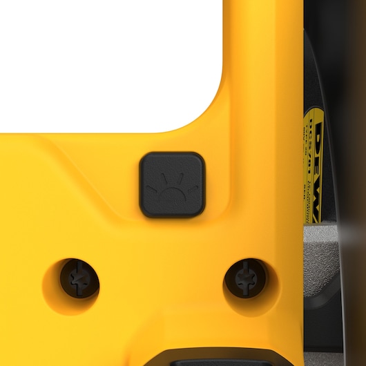 Close-up of a yellow DEWALT power tool showing a black button with a light icon, indicating a built-in illumination feature. Visible screws and part of the DEWALT DCS781 label are also shown.