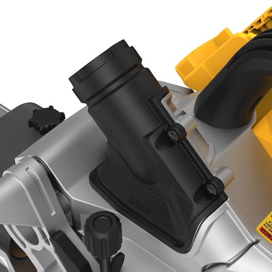 Close-up view of a DEWALT power tool showing the dust extraction port and part of the tool’s adjustment mechanisms, featuring black and yellow components.