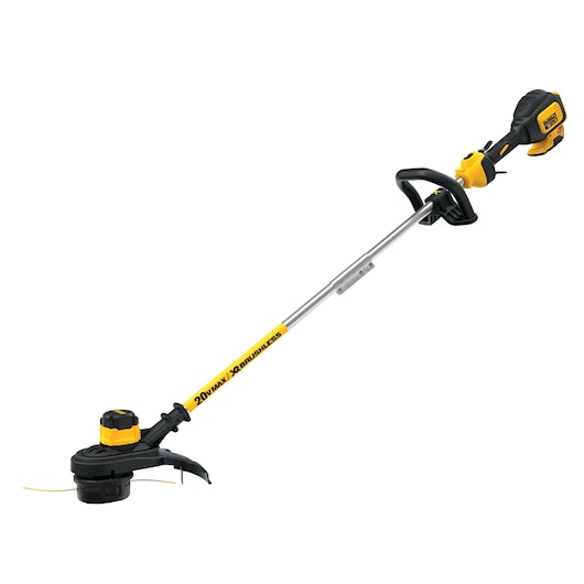 A DEWALT 20V MAX XR cordless brushless string trimmer with a yellow and black design, featuring a straight shaft and handle, used for cutting grass and trimming lawn edges.
