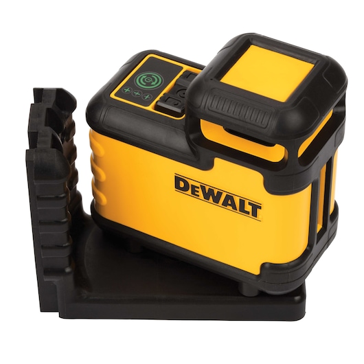 A DEWALT-branded yellow and black rotary laser level device placed on a black mounting base, used for precise measurements in construction and photography.