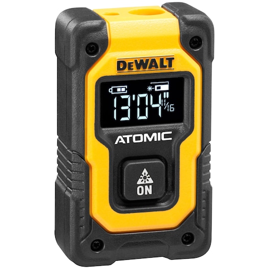 A DEWALT branded yellow and black laser distance measurer with digital display showing measurement values, labeled 'ATOMIC' and featuring an ON button.