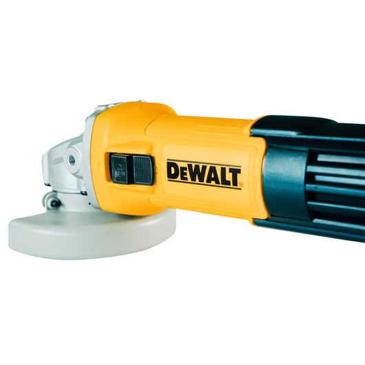 Close-up image of a DEWALT DWE750 angle grinder, showing the yellow body, black switch, and part of the silver grinding guard.