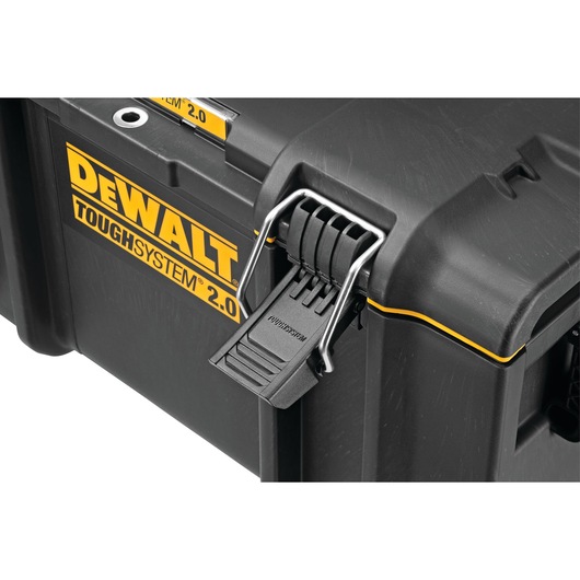 Close-up view of a DEWALT ToughSystem 2.0 black and yellow tool storage box, showing a secure latch and bold DEWALT branding on the side.
