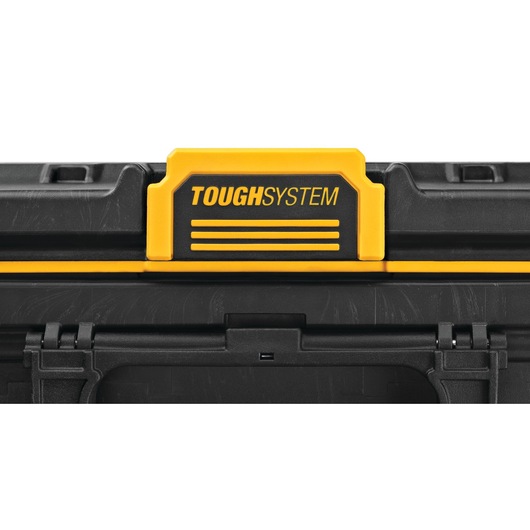 Close-up image of a DEWALT ToughSystem storage box, showing the yellow and black branding label on the lid.