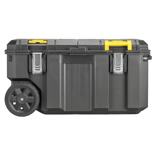 A large black DEWALT mobile tool box with two metal latches, two wheels, and yellow handles on the top.