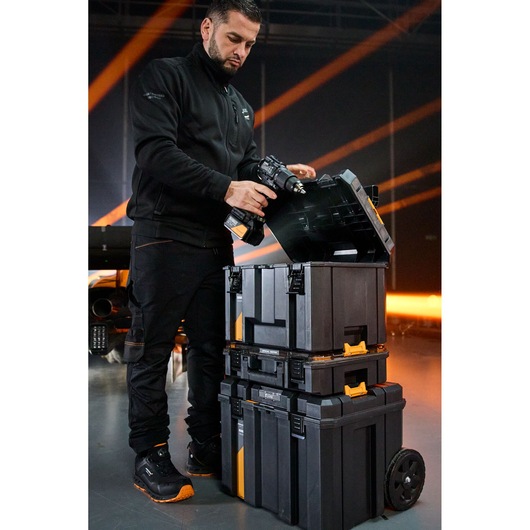 Photography storage cases stacked, wheeled with compartments for equipment protection and transport.